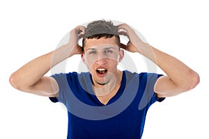 Flabbergasted man with hands in hair