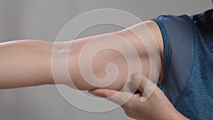 The flabbiness and wrinkled of senior woman arm skin