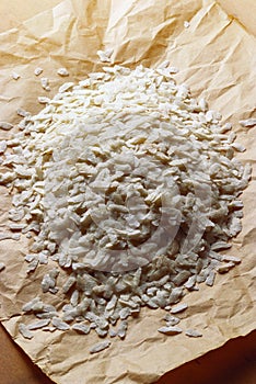 Flacked rice poha on paper, India