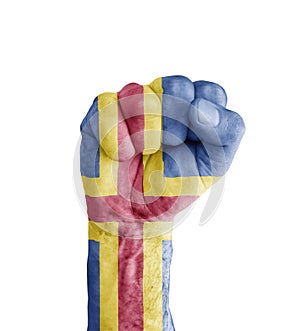 Flag of Aland painted on human fist like victory symbol