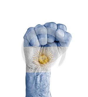 Flag of Argentina painted on human fist like victory symbol photo