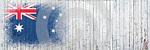 Flag of Australia. Flag is painted on a white wooden surface. Wooden background. Plywood surface. Copy space. Textured background