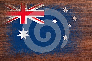 Flag of Australia. Flag is painted on a wooden surface. Wooden background. Plywood surface. Copy space. Textured background