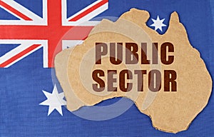 On the flag of Australia lies the contour of the map of the country with the inscription - PUBLIC SECTOR