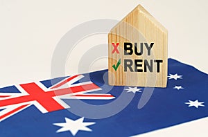 On the flag of Australia there is a model of a wooden house with the inscription - Rent or Buy