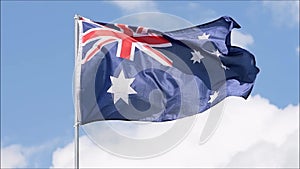 The flag of the Australia waves in the wind in slow motion