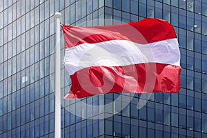 Flag Austria on the background of a modern building