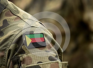 Flag of Azawad on soldiers arm. Flag of State of Azawad on military uniforms. Army, troops. Collage