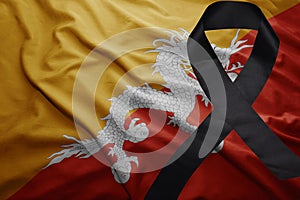 Flag of bhutan with black mourning ribbon