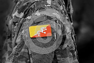 Flag of Bhutan on soldiers arm. Flag of Bhutan on military uniforms (collage).