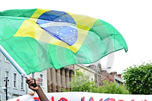 Flag of Brazil being held on a Protest