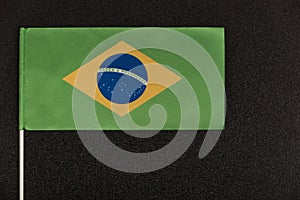 Flag of Brazil on black background. Ordem e Progresso photo