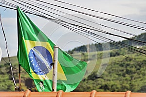 The flag of Brazil on the roof of the house photo