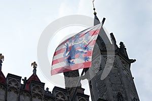 Flag of Bruges fluttering at the town hall.