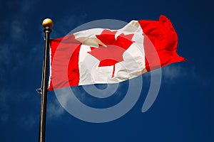 Flag of Canada against a blue sky