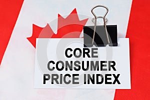 On the flag of Canada lies a business card with the inscription - core consumer price index