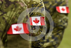 Flag of Canada on military uniform. Canadian soldiers. Army of Canada. Remembrance Day