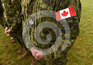 Flag of Canada on military uniform. Canadian soldiers. Army of Canada. Remembrance Day photo