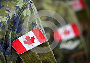 Flag of Canada on soldiers arm. Canadian troops. Canadian Army