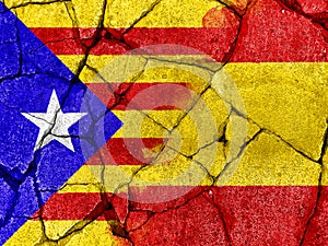 flag of Catalonia on crack cement to communicate the split between Spain and Catalan country