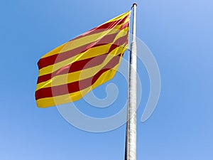 Flag of Catalonia in front of Montjuic Castle, Barcelona