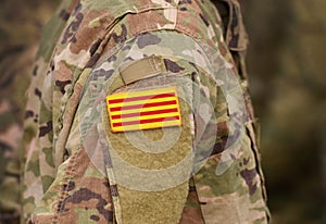 Flag of Catalonia Senyera on military uniform. Collage