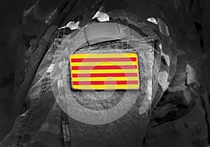 Flag of Catalonia Senyera on military uniform. Collage