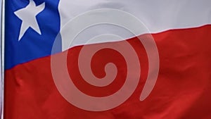 The flag of Chile waves in the wind in slow motion