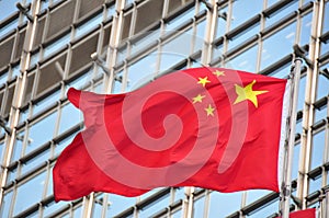 Flag of China in front of building