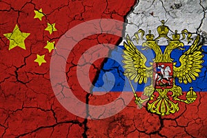 Flag of China and Russia on Textured Cracked Earth. The concept of cooperation between the two countries