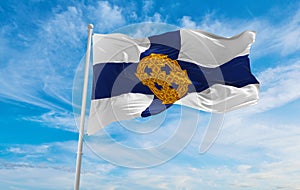 flag of Church in Wales at cloudy sky background on sunset, panoramic view. united kingdom of great Britain, England. copy space