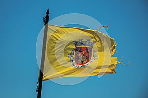 Flag with the coat of arms in the Castelo de Vide town