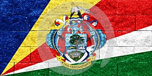 Flag and coat of arms of Republic of Seychelles on a textured background. Concept collage