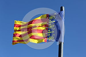 Flag of Comunidad Valenciana, region in Spain, moving in the wind photo