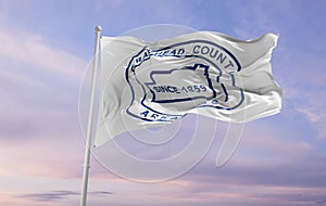 flag of county Craighead, Arkansas , USA at cloudy sky background on sunset, panoramic view. Patriotic concept about Craighead,