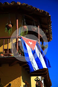 Flag of Cuba on the second floor of the Casa de los Conspiradores building. Trinidad, Cuba