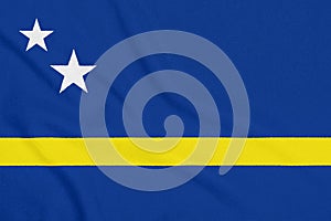 Flag of Curacao on textured fabric. Patriotic symbol