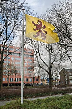 Flag of dutch province South Holland is flying in the wind