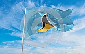 flag of English Creole peoples Saint Lucians at cloudy sky background, panoramic view. flag representing extinct country,ethnic