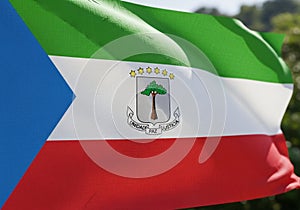 Flag of Equatorial Guinea waving in the wind. It features horizontal