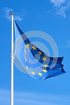 Flag of Europe against a clear blue sky.