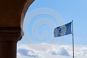 Flag of Europe against a clear blue sky.