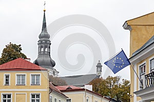European Union flag waving on wind outdoors in european old town, EU photo