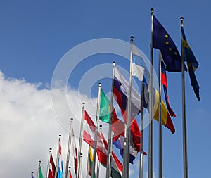 flag of Europe and other flags on the background with blue sky