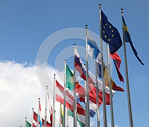 flag of Europe and other flags on the background with blue sky