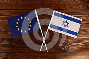 Flag of European Union and flag of Israel crossed with each other. The image illustrates the relationship between countries