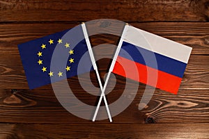 Flag of European Union and flag of Russia crossed with each other. The image illustrates the relationship between countries