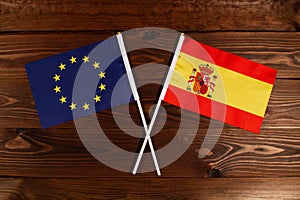 Flag of European Union and flag of Spain crossed with each other. The image illustrates the relationship between countries