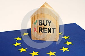 On the flag of the European Union there is a model of a wooden house with the inscription - Buy or Rent