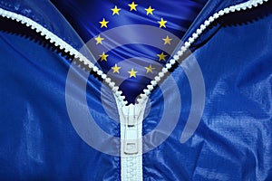 Flag of the European Union under a blue unpacked zipper